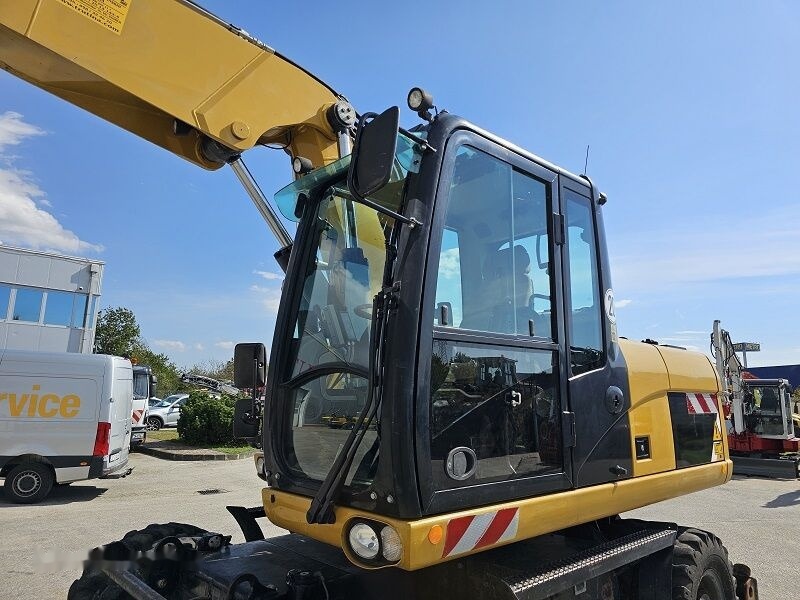 Pelle sur pneus Caterpillar M315D: photos 8