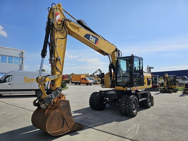 Pelle sur pneus Caterpillar M315D: photos 6